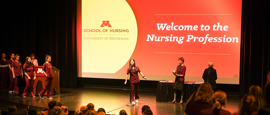 Welcome to the Nursing Profession slide with pre-licensure students on the stage